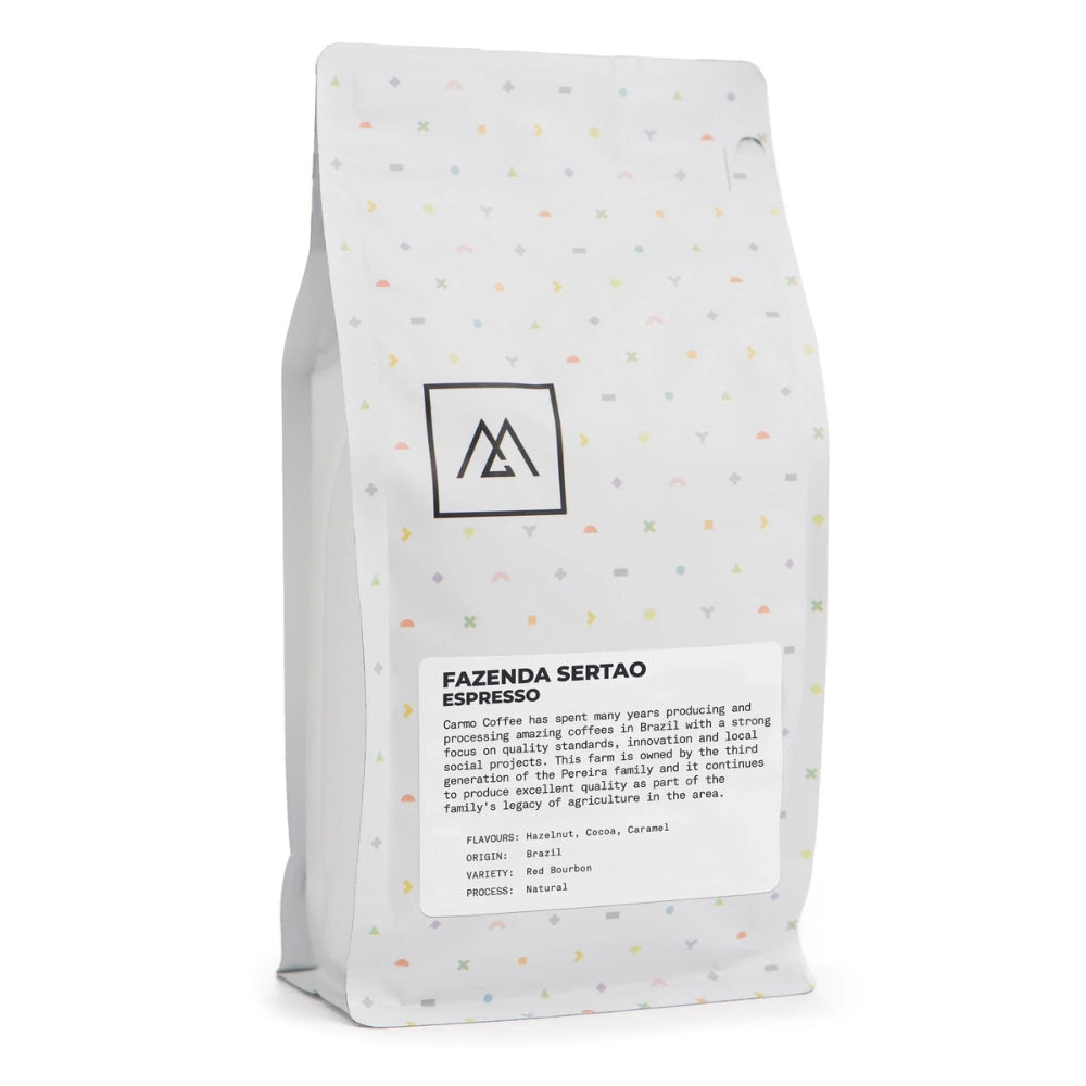 Experience the flavors of Brazil with Monogram Coffee's Fazenda Sertao Espresso, sourced from the Pereira family farm in collaboration with Carmo Coffee. Enjoy the rich taste of hazelnut, cocoa, and caramel in this natural processed Red Bourbon espresso. Learn about our commitment to quality and sustainable sourcing.