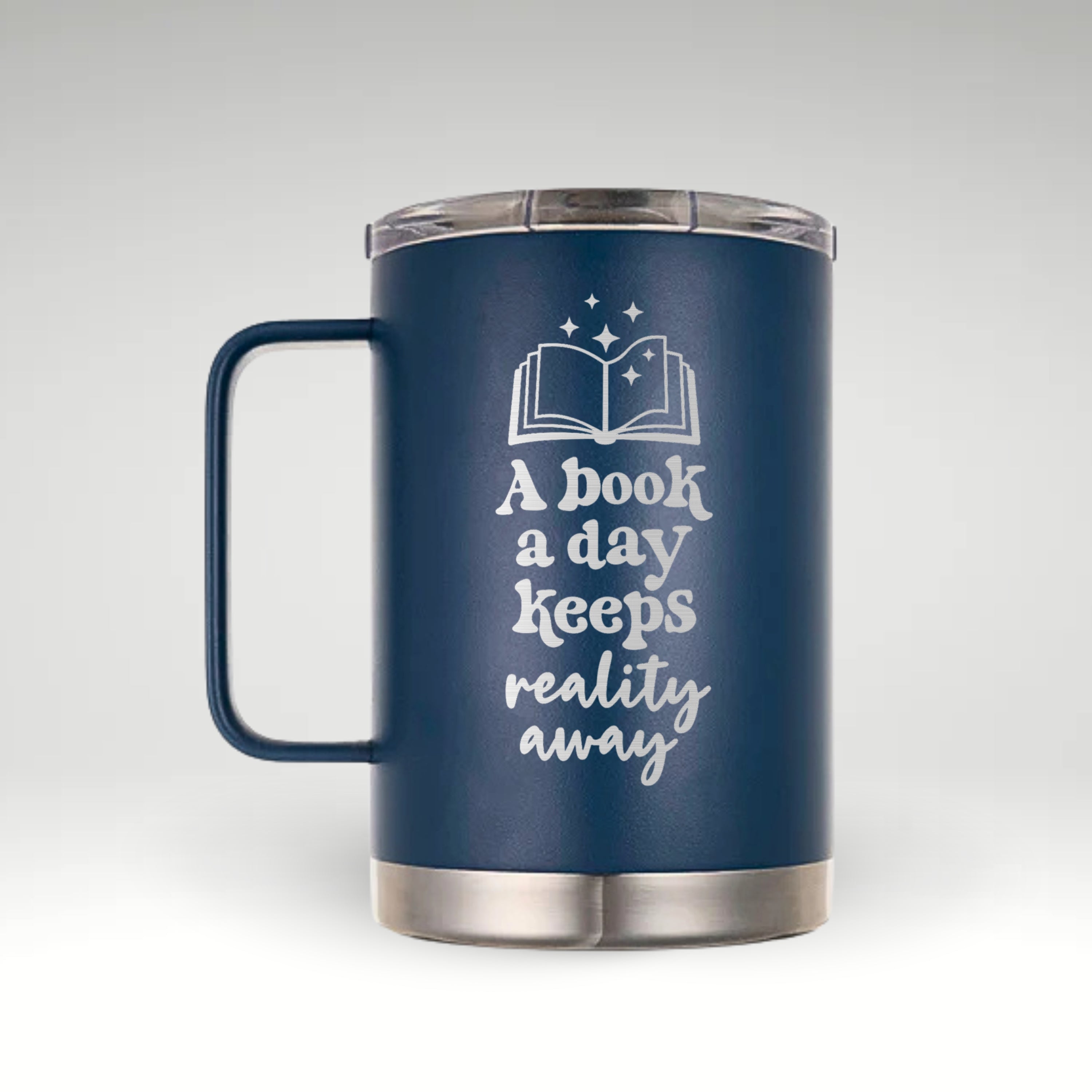 Escape Reality with Every Sip Insulated mug with the quote 'A Book a Day Keeps Reality Away' and an illustration of an open book surrounded by sparkling stars in black and white.