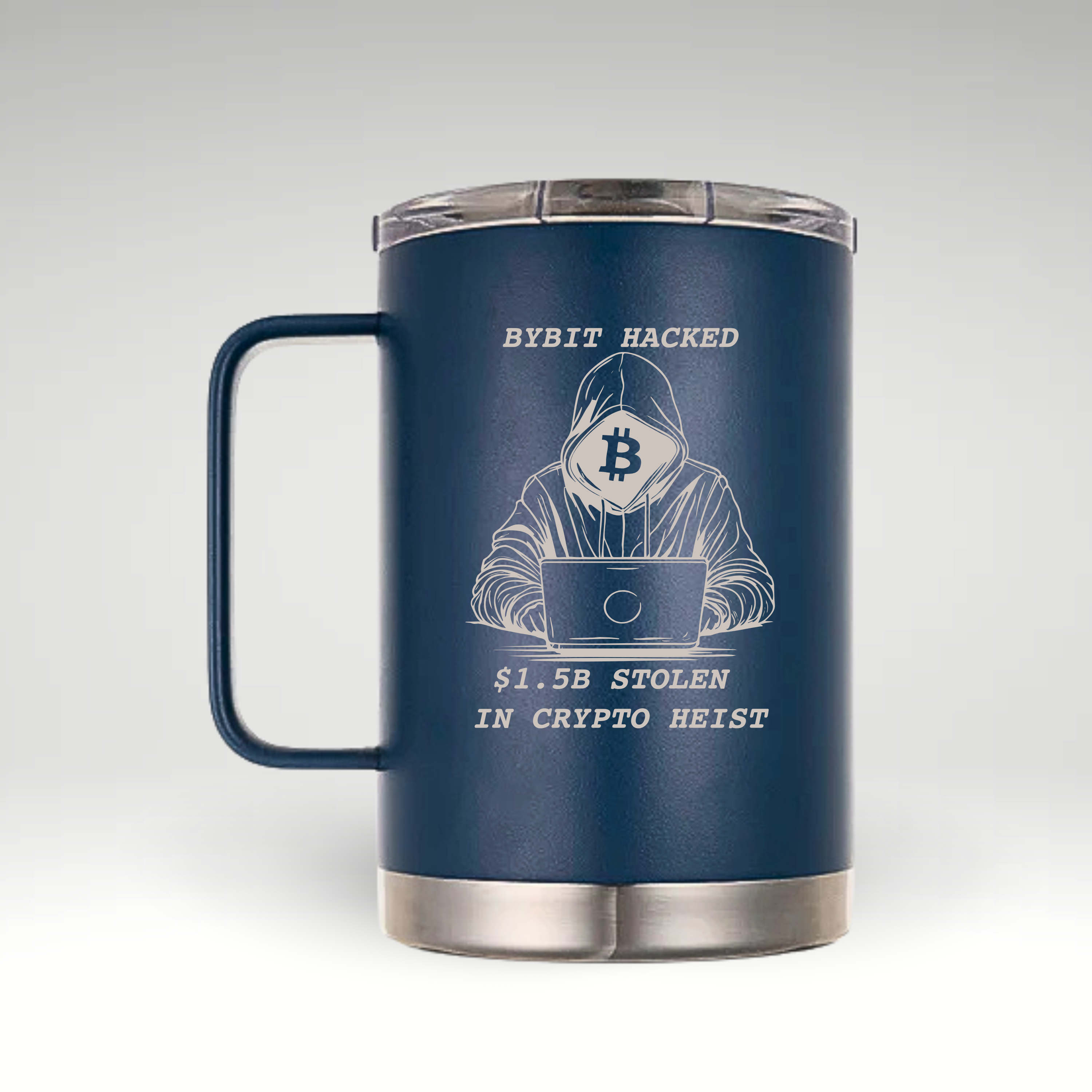 Alt text: A navy blue insulated coffee mug with a handle and a clear lid. The mug features an engraved design of a hooded figure using a laptop, with a Bitcoin logo covering their face. Above the figure, the text reads "BYBIT HACKED," and below, it states "$1.5B STOLEN IN CRYPTO HEIST." The engraving is in a light color, contrasting with the dark blue mug.