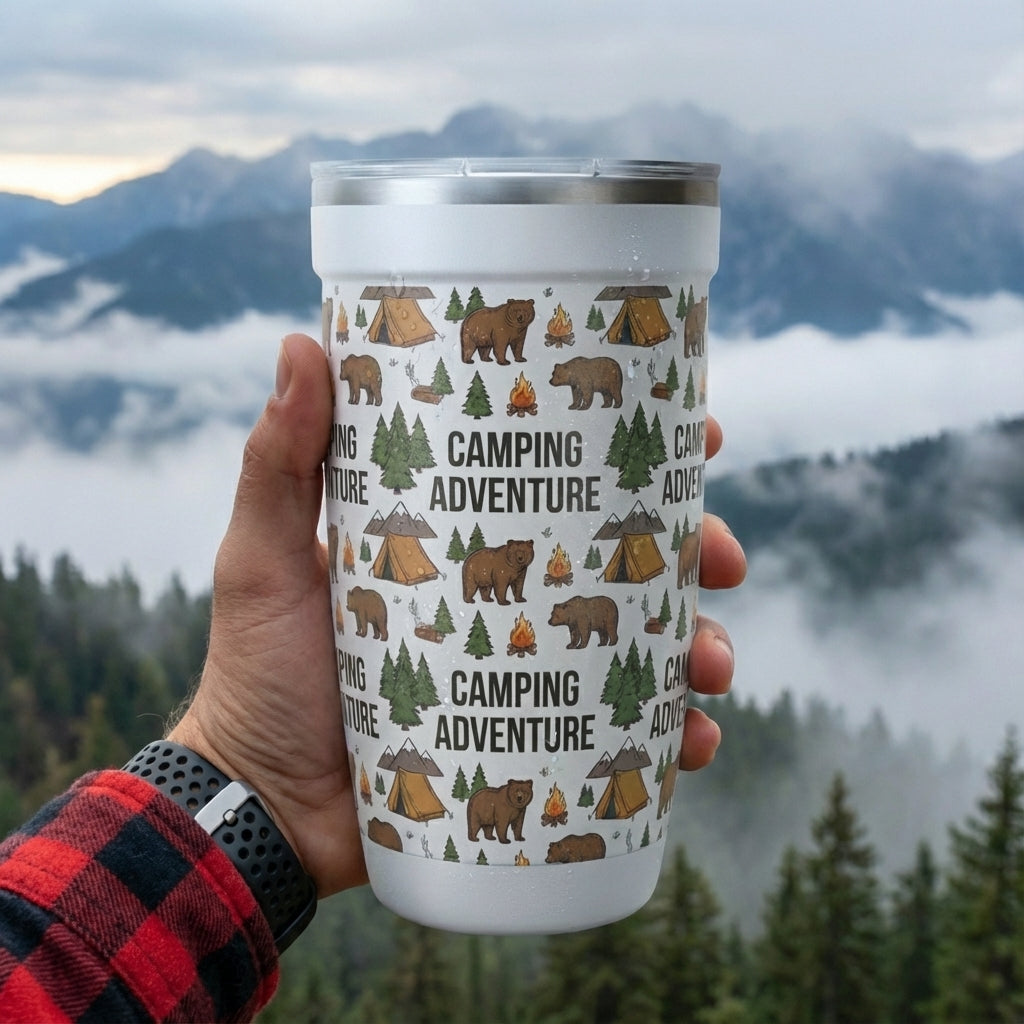 In-Use shot - White LAMOSE Peyto 16oz tumbler featuring a 5D printed pattern of brown bears, tents, pine trees, campfires, and 'Camping Adventure' text.