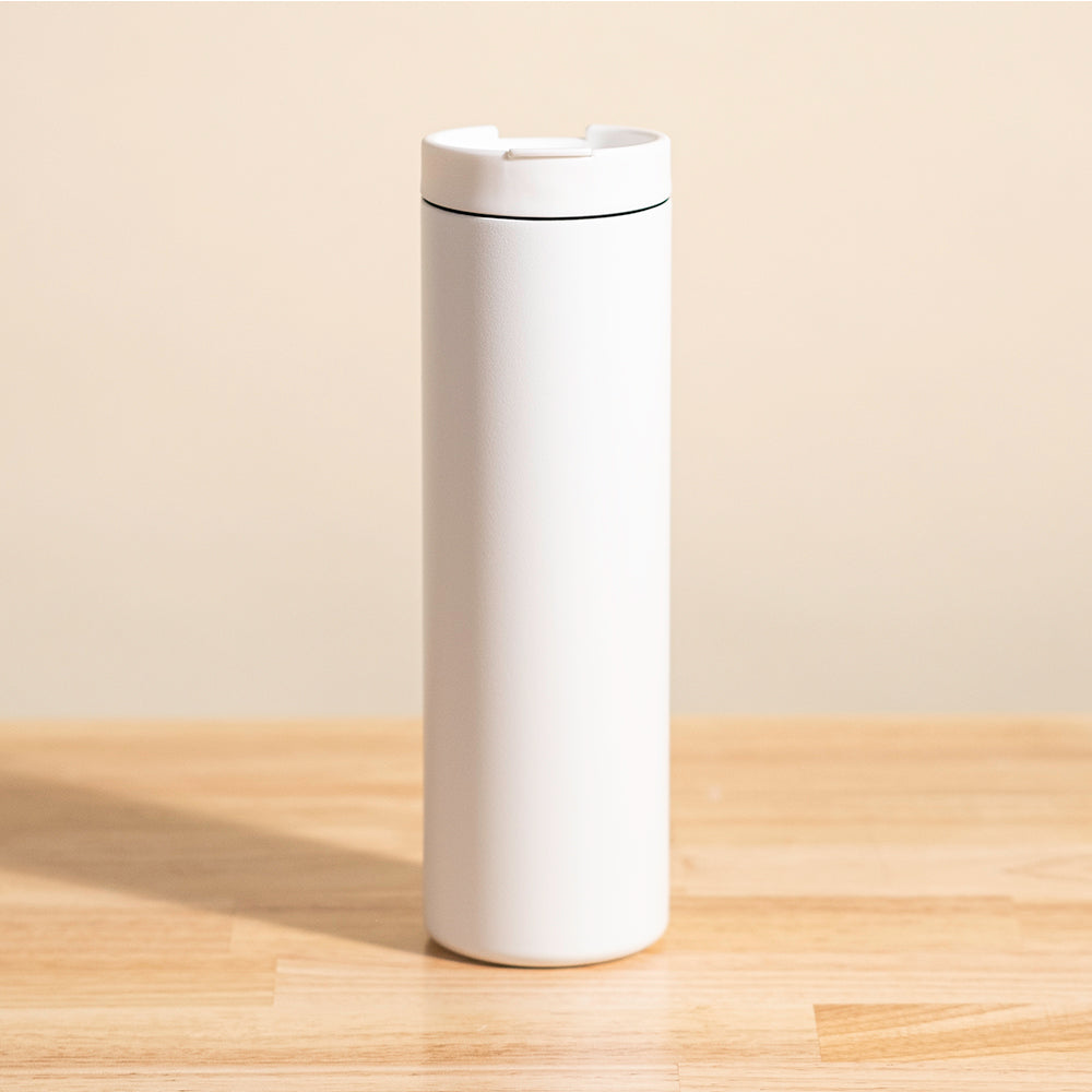 LAMOSE Grouse 20 oz insulated tumbler in snow white, a matte stainless steel travel mug with a simple white lid and black accent ring, front view.