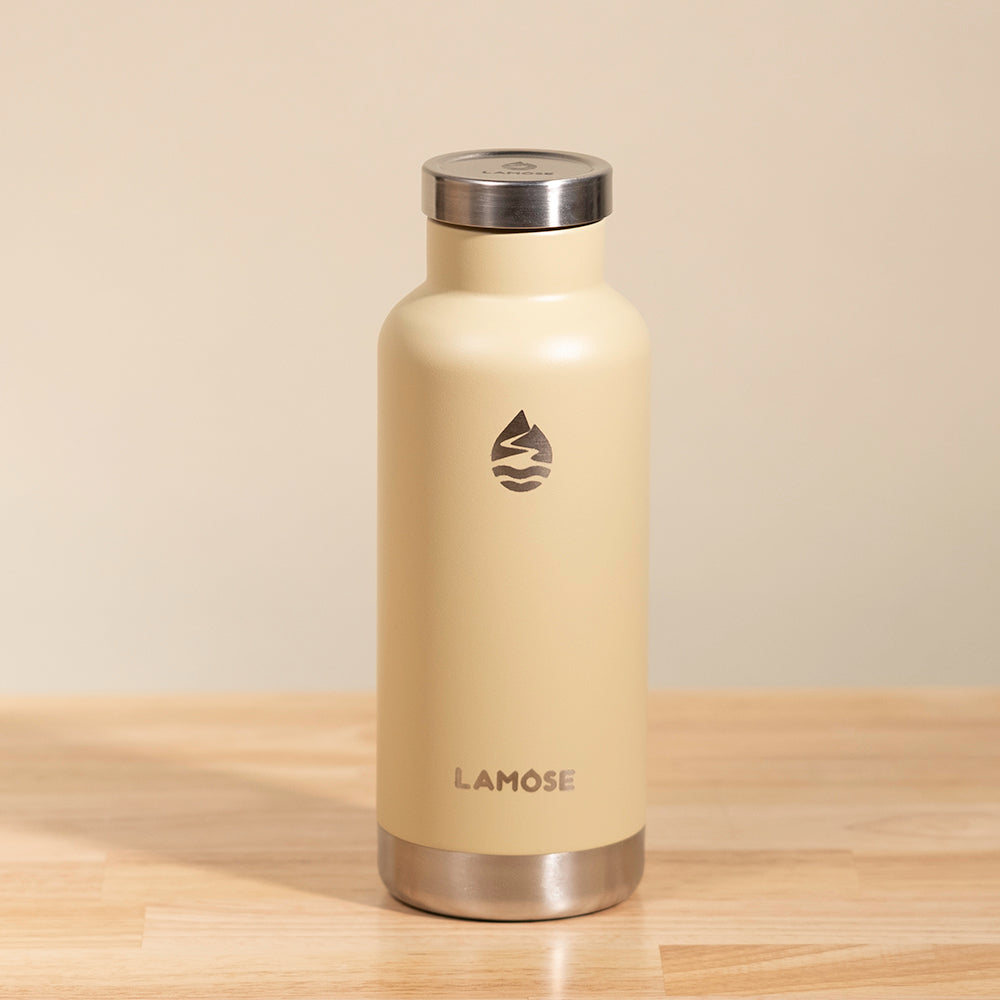 LAMOSE Moraine insulated bottle 20 oz in sand, 18/8 stainless steel, front view showing brand logo and text.