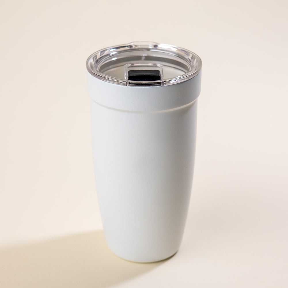 LAMOSE white Peyto ceramic 16 oz tumbler, upright with clear lid showing black slider, on a light background.