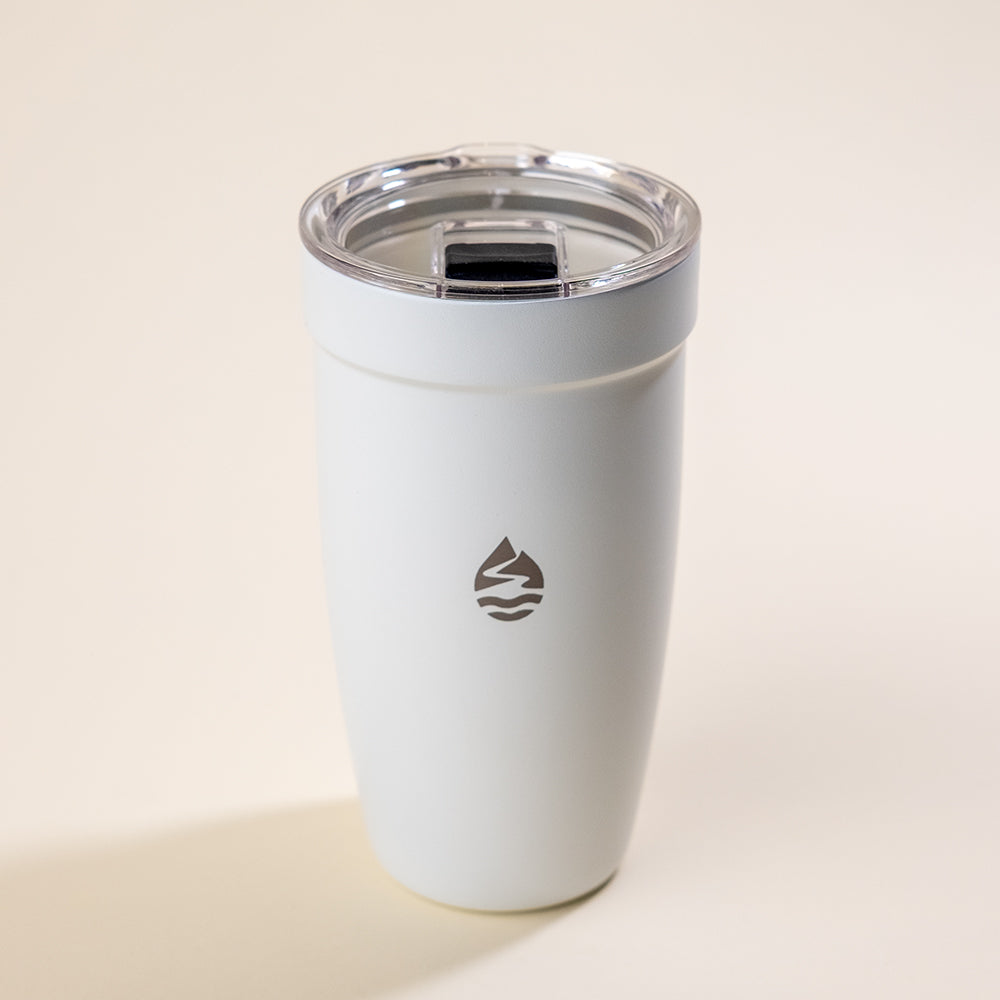 LAMOSE Peyto 16 oz white ceramic insulated tumbler with clear lid and black slide closure, featuring the unique LAMOSE droplet logo, front view.