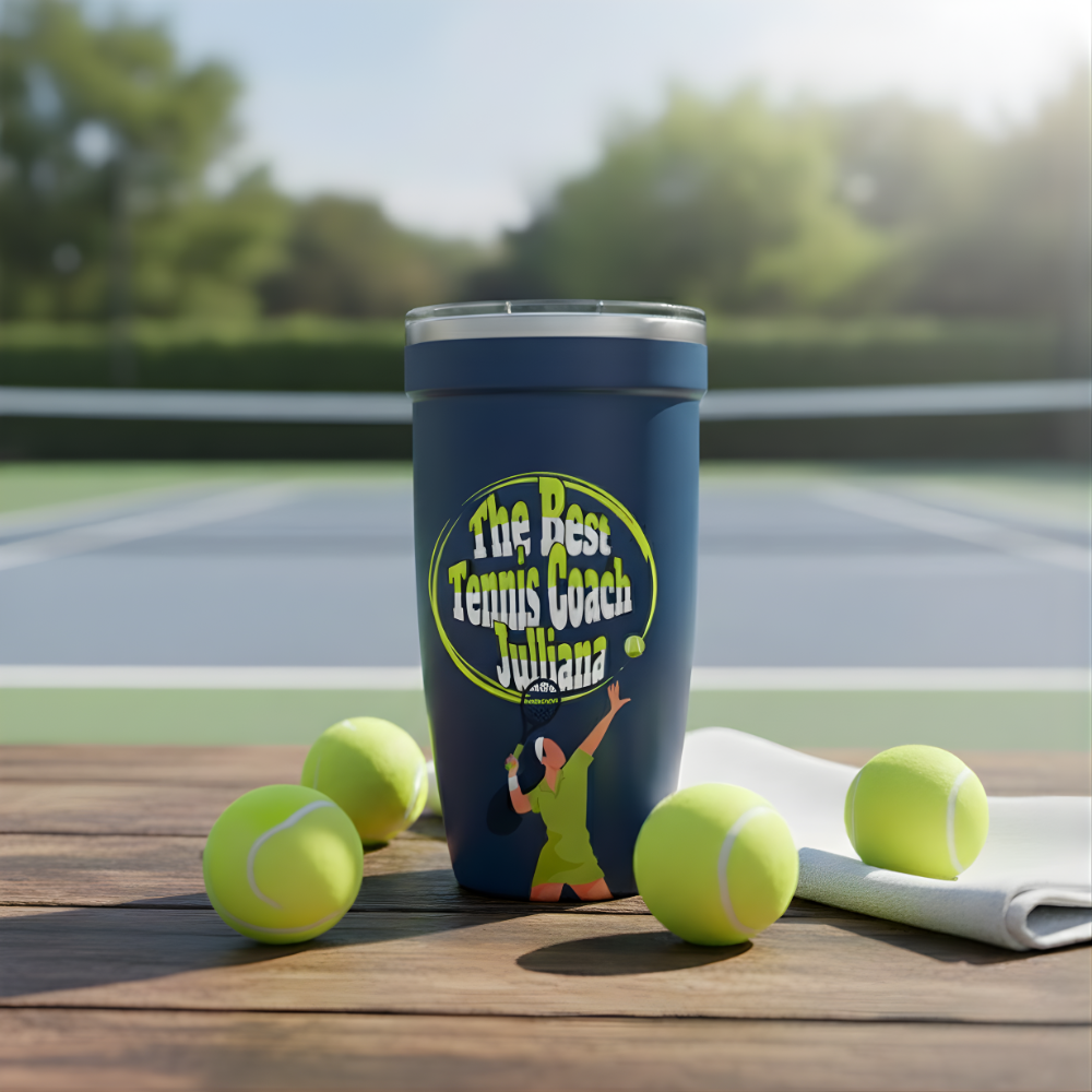 Dark blue Peyto 16oz tumbler featuring colorful tennis court graphics and text 'The Best Tennis Coach Juliana' sitting on a wooden bench with tennis balls.