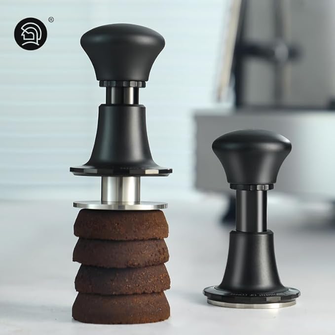 Adjustable espresso tamper with spiral-textured stainless steel base, ergonomic black handle, and precision leveling design for even coffee puck compression.