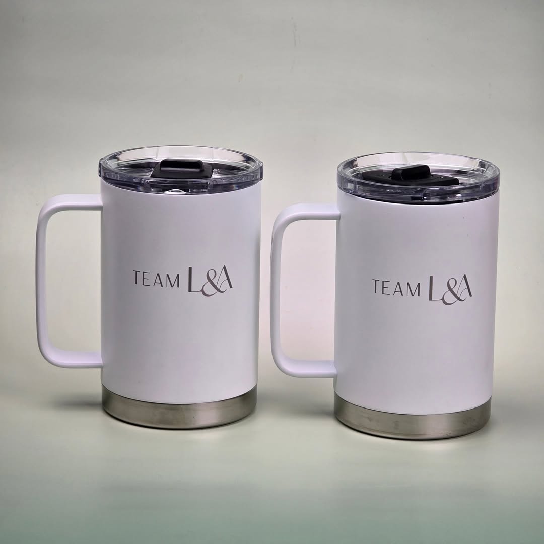 LAMOSE Hudson Pro Max 24 oz insulated mugs in Snow, showcasing custom 'Team L&A' engraving, stainless steel base, and black lid.