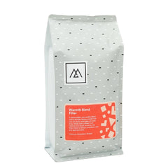 Warmth Filter Blend by Monogram Coffee. A smooth and rich blend with notes of chocolate and nougat. Crafted from fresh harvest coffees sourced from Central and South America. Perfect for daily enjoyment.