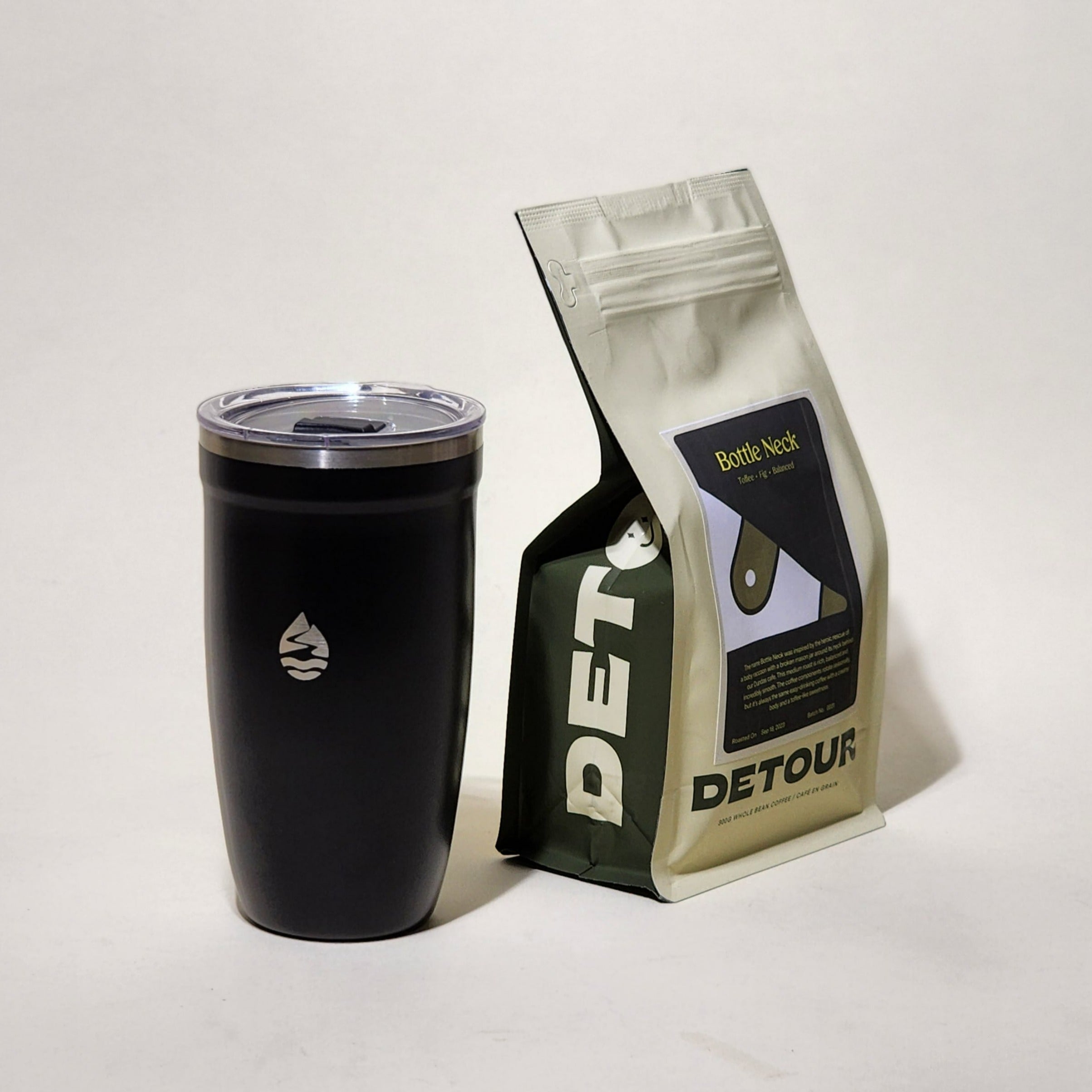 Detour Coffee Roaster Bottleneck Blend - Chocolate, Toffee, Fig Tasting Profile - Filter Balanced Coffee Style - Seasonal Celebration - Consistent Flavor Profile - Smooth Everyday Sipper - Creamy Texture - Approachable Complexity - Baby Raccoon Rescue Inspiration - Learn More on Our Website