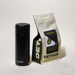 Detour Coffee Roaster Bottleneck Blend - Chocolate, Toffee, Fig Tasting Profile - Filter Balanced Coffee Style - Seasonal Celebration - Consistent Flavor Profile - Smooth Everyday Sipper - Creamy Texture - Approachable Complexity - Baby Raccoon Rescue Inspiration - Learn More on Our Website