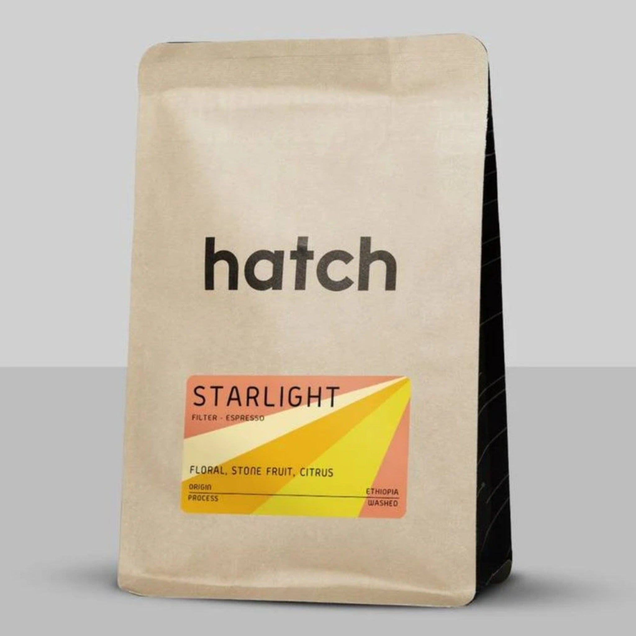 Hatch Coffee - Starlight: Explore a journey of flavor with this versatile medium-light roast from Bombe Village, Sidama Bensa, Ethiopia. Delight in floral, stonefruit, and citrus notes, perfect for both vibrant espressos and filter brews. Discover more about our core coffee offerings: Supernova, Starlight, Gamma, and Blackout blends.