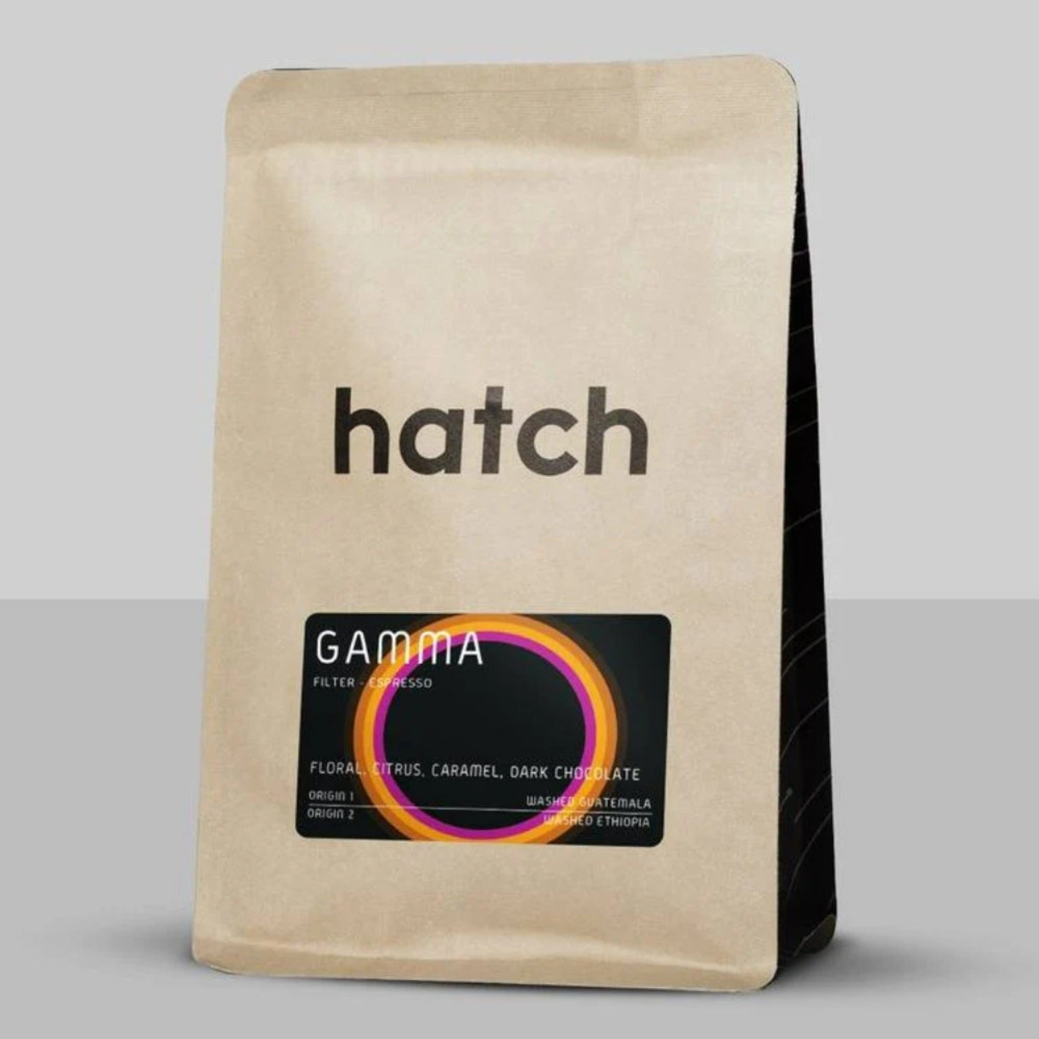 Hatch Coffee - Gamma: A tribute to Northern Italian espresso, balancing vibrant acidity with a chocolatey finish. Crafted from Guatemala and Ethiopia beans, with floral, citrus, caramel, and dark chocolate notes. Ideal for espresso brewing. Explore our core coffee offerings: Supernova, Starlight, Gamma, and Blackout blends.