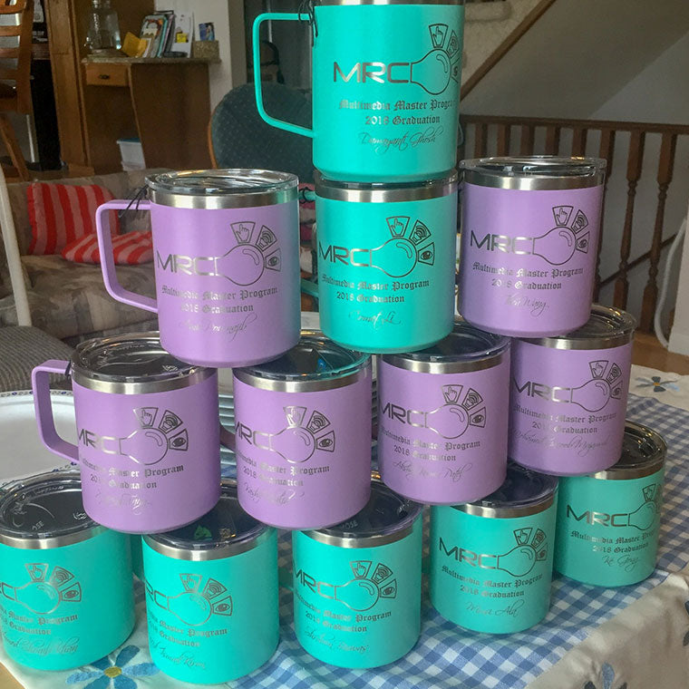 Stacked LAMOSE insulated stainless steel mugs in teal and lavender, custom laser engraved for MRCI Multimedia Master Program 2018 Graduation.