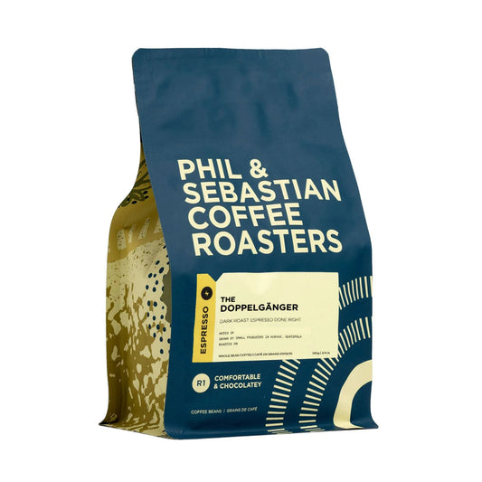 Phil & Sebastian Coffee Roasters' THE DOPPELGÄNGER ESPRESSO. Delicious espresso with notes of chocolate, nougat, and caramel. Sourced from individual farms and co-ops. Ideal for Super Automatic espresso machines.