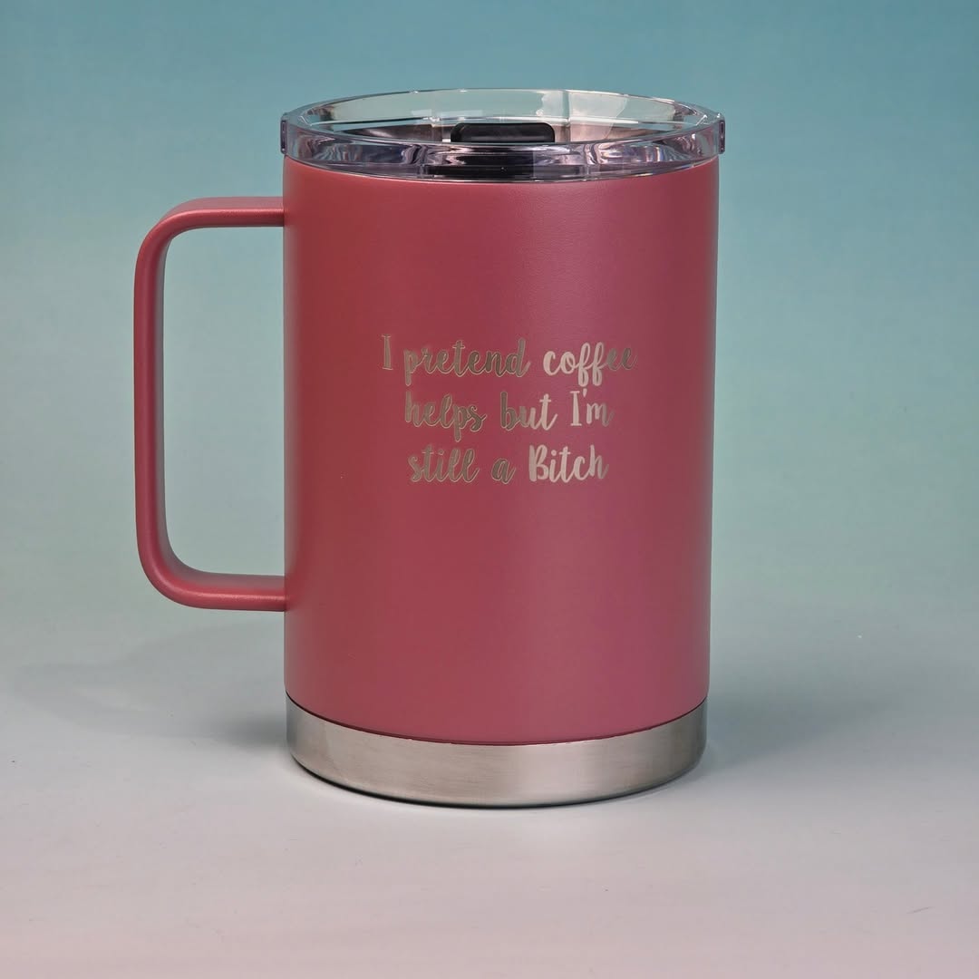 Pink insulated stainless steel mug with a humorous engraved quote about coffee and attitude. 