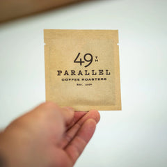 Experience the enticing flavors of 49th Parallel Coffee's Direct Trade Coffee instant packs, adorned with taste notes of almonds, golden raisins, and pineapples. Discover specialty coffee convenience at its finest.