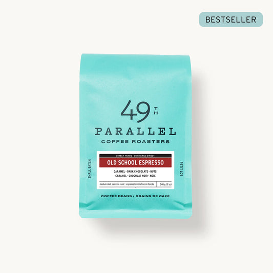 Old School Espresso by 49th Parallel Coffee Roasters. A medium-dark roast with flavors of caramel, dark chocolate, and nuts. Crafted from Indian Ratnagiri Estate and Colombian Tolima Organic beans for a rich and comforting espresso experience.
