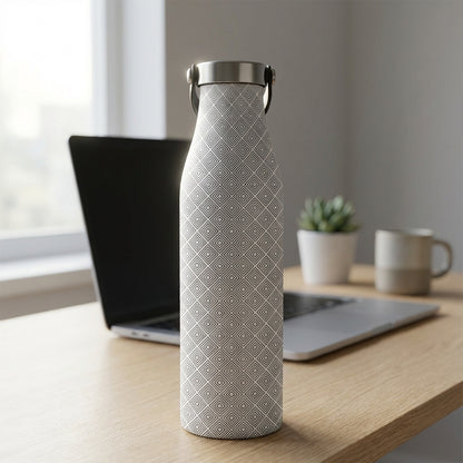 Robson 21oz insulated stainless steel bottle featuring a grey concentric square diamond pattern standing on a wooden office desk next to a plant.