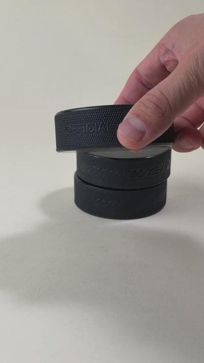 Custom engraved hockey puck with precision laser etching, featuring personalized text and designs. Perfect for coaches, players, and team memorabilia.